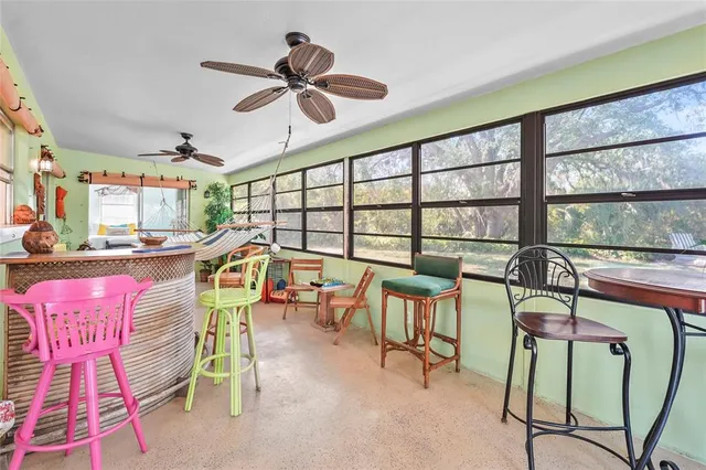 a spacious bedroom with a bed and a window