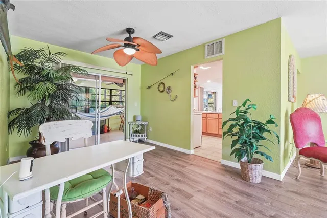 a view of a dining room with furniture and a window