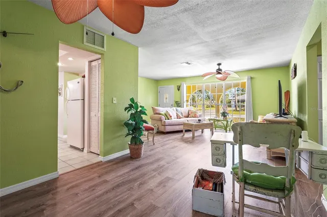 a dining room with furniture and a chandelier