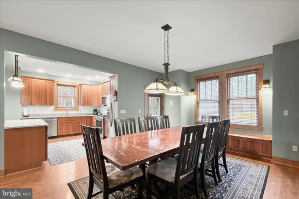 a view of a dining room with furniture window and wooden floor