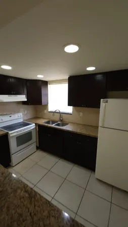 a view of a window and a refrigerator