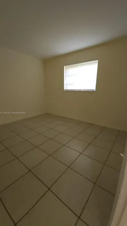 a view of a utility room and empty room