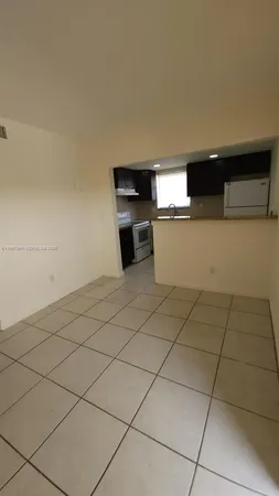 a kitchen with stainless steel appliances a sink and a stove