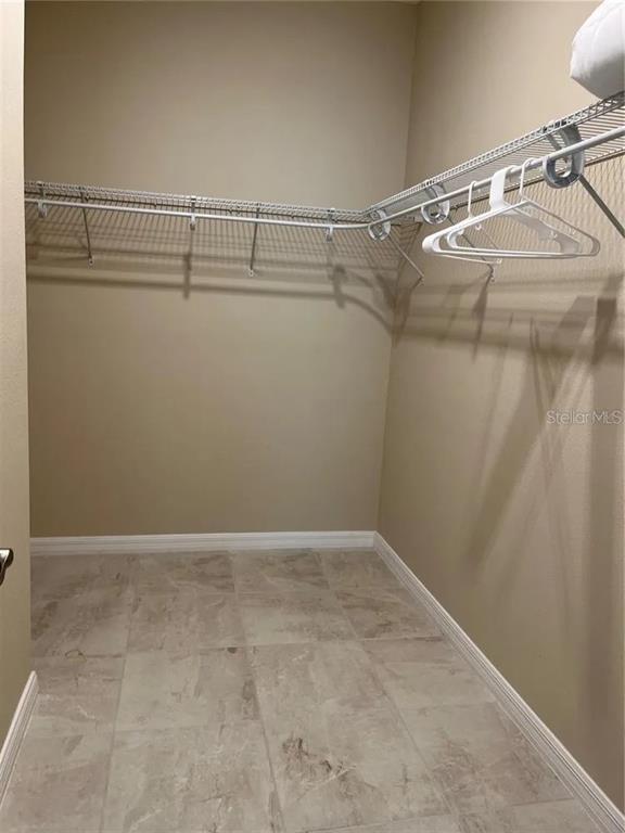 9879 Southwest 99th Loop Ocala, FL 34481 - Photo 11 of 12 a view of a room with racks on the wall