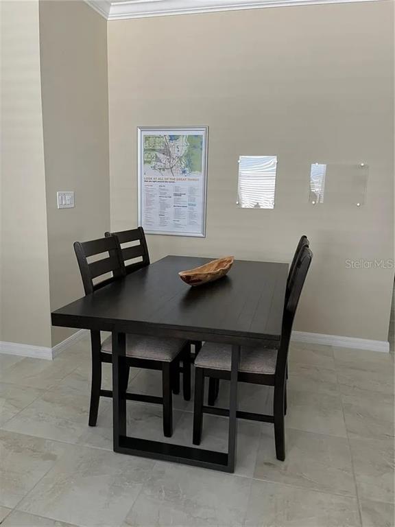 9879 Southwest 99th Loop Ocala, FL 34481 - Photo 5 of 12 a view of a workspace with furniture