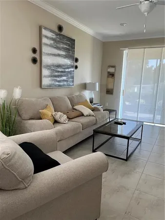 a bedroom with a bed and painting on the wall