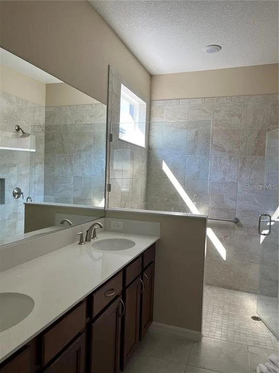 9879 Southwest 99th Loop Ocala, FL 34481 - Photo 10 of 12 a bathroom with a sink and a mirror
