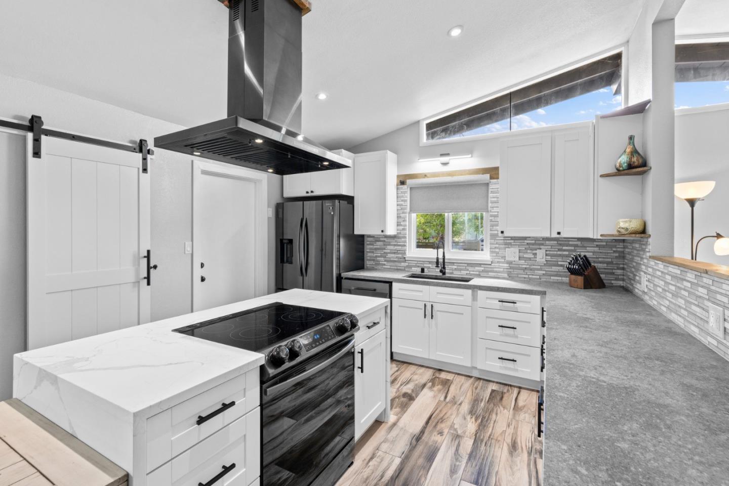 1430 Spruce Street Livermore, CA 94551 - Photo 11 of 32 a kitchen with granite countertop a sink stainless steel appliances and cabinets