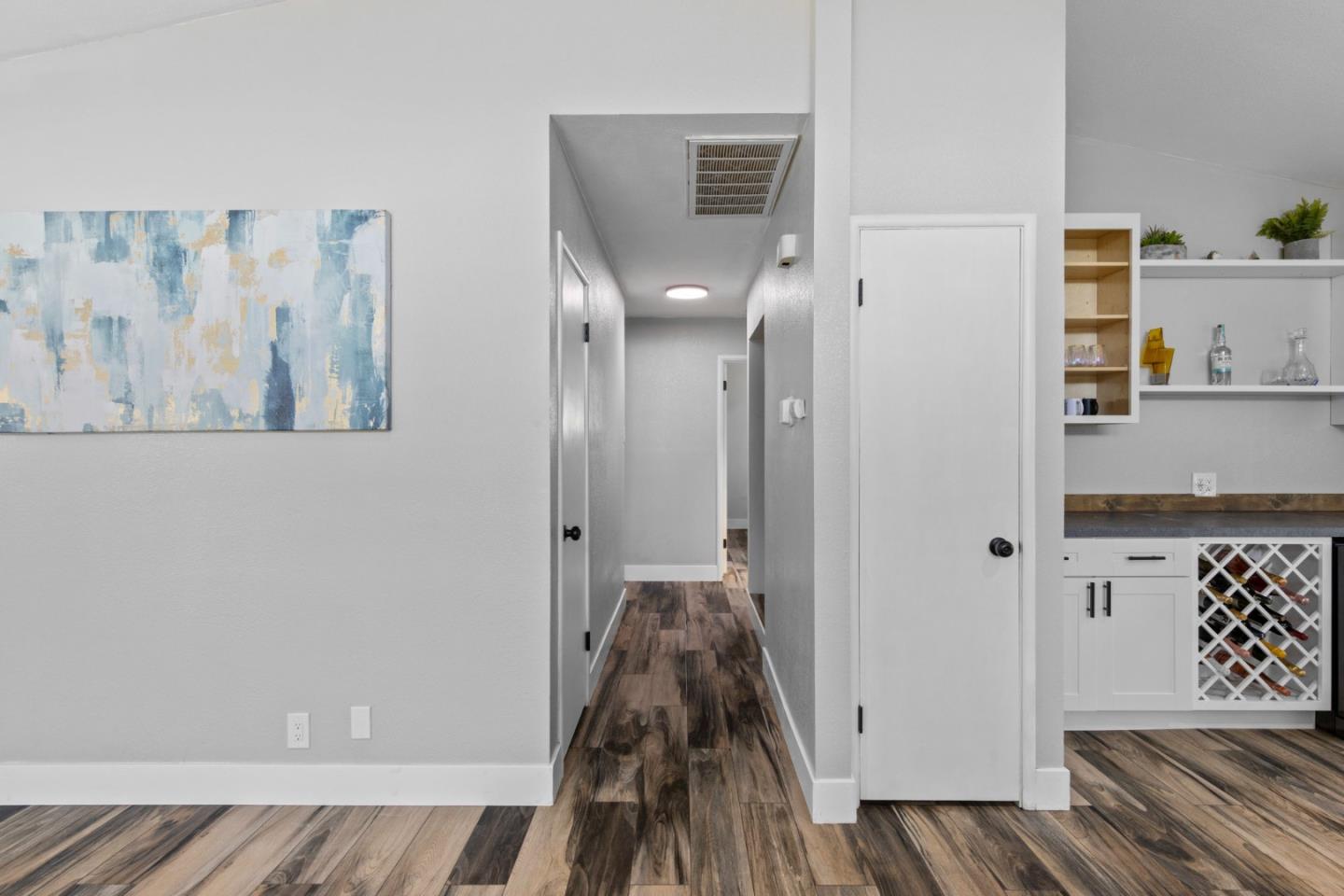 1430 Spruce Street Livermore, CA 94551 - Photo 15 of 32 a view of a hallway with wooden floor and staircase