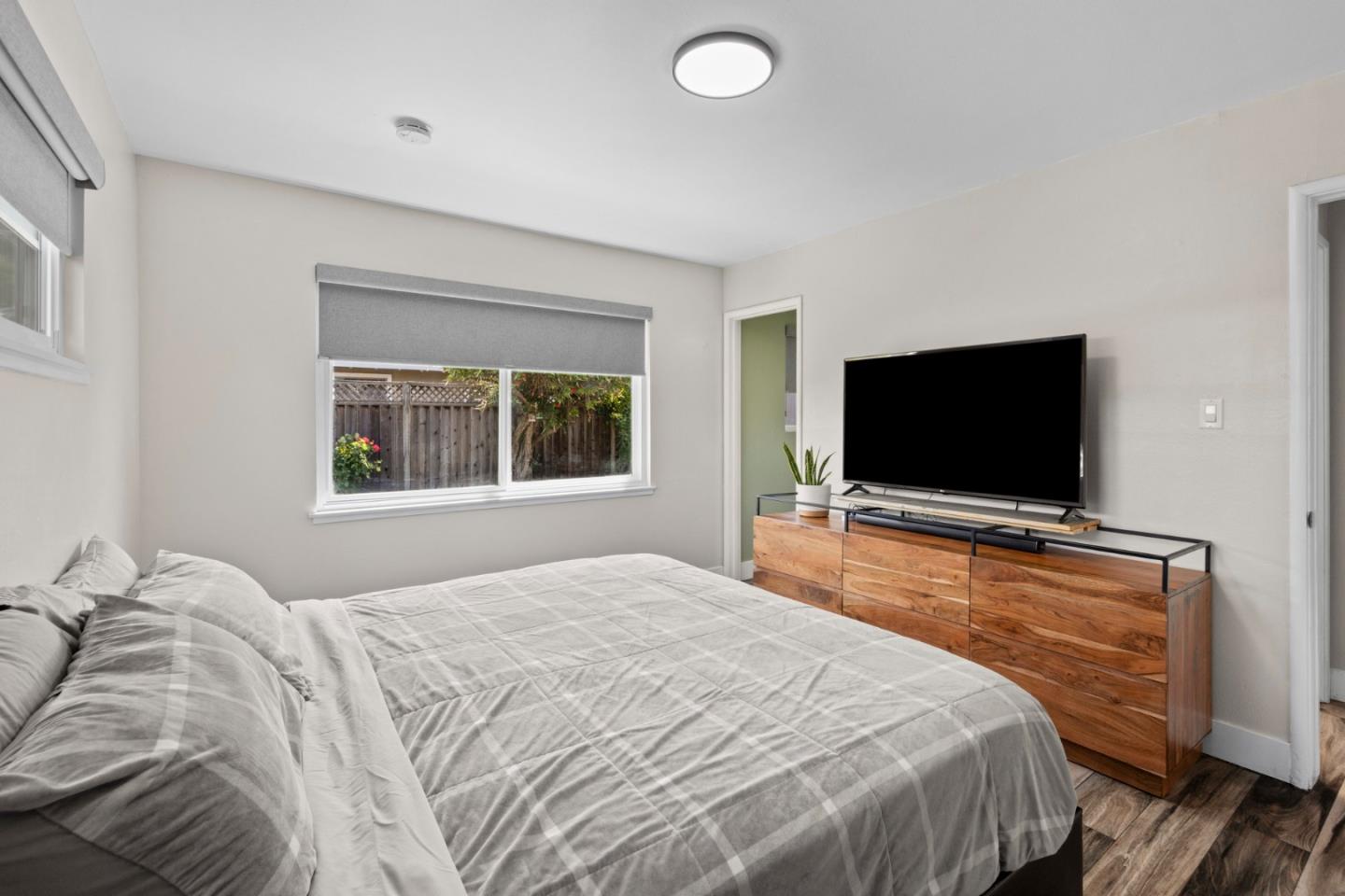 1430 Spruce Street Livermore, CA 94551 - Photo 17 of 32 a bedroom with a flat screen tv and a bed