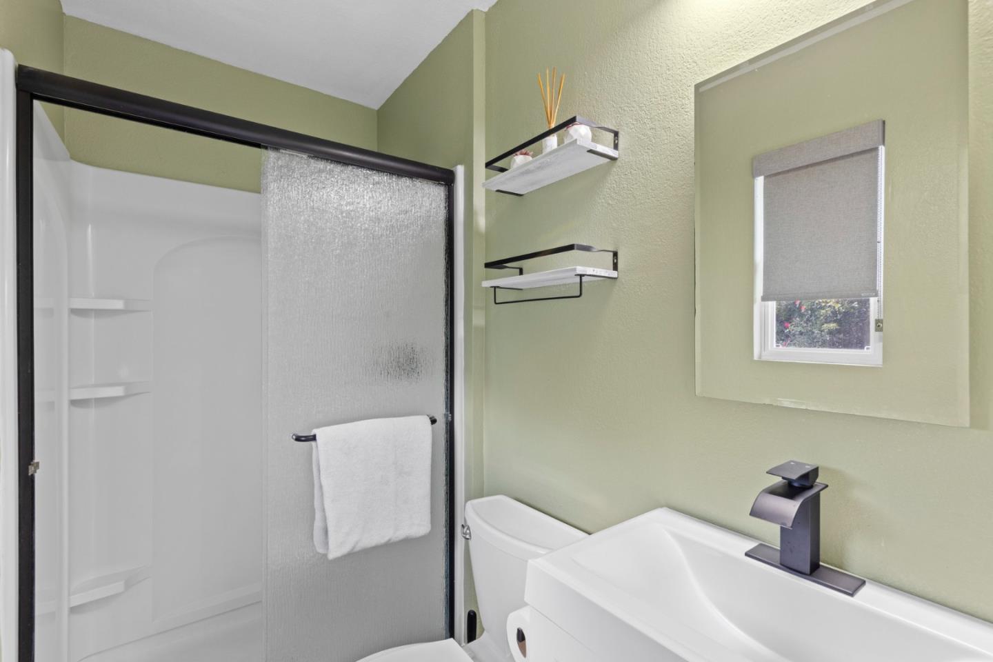 1430 Spruce Street Livermore, CA 94551 - Photo 19 of 32 a bathroom with a sink and shower