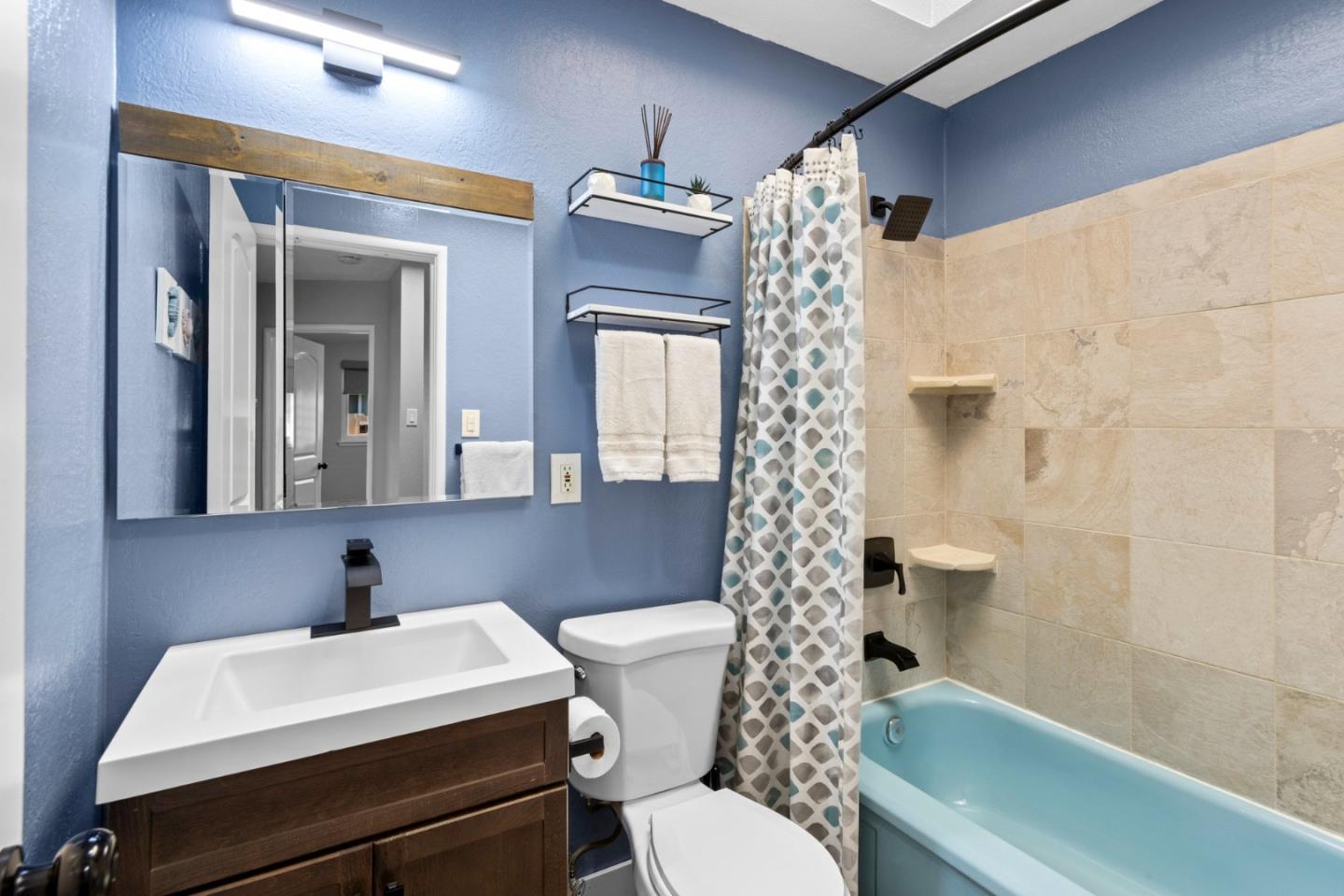1430 Spruce Street Livermore, CA 94551 - Photo 24 of 32 a bathroom with a sink a toilet and shower