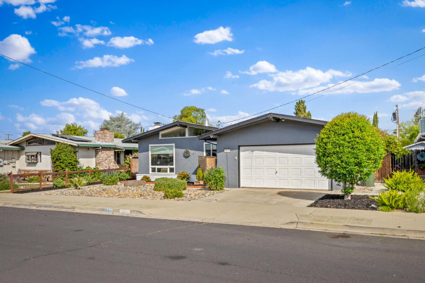 1430 Spruce Street Livermore, CA 94551 - Photo 32 of 32 a front view of a house with a yard and a garage