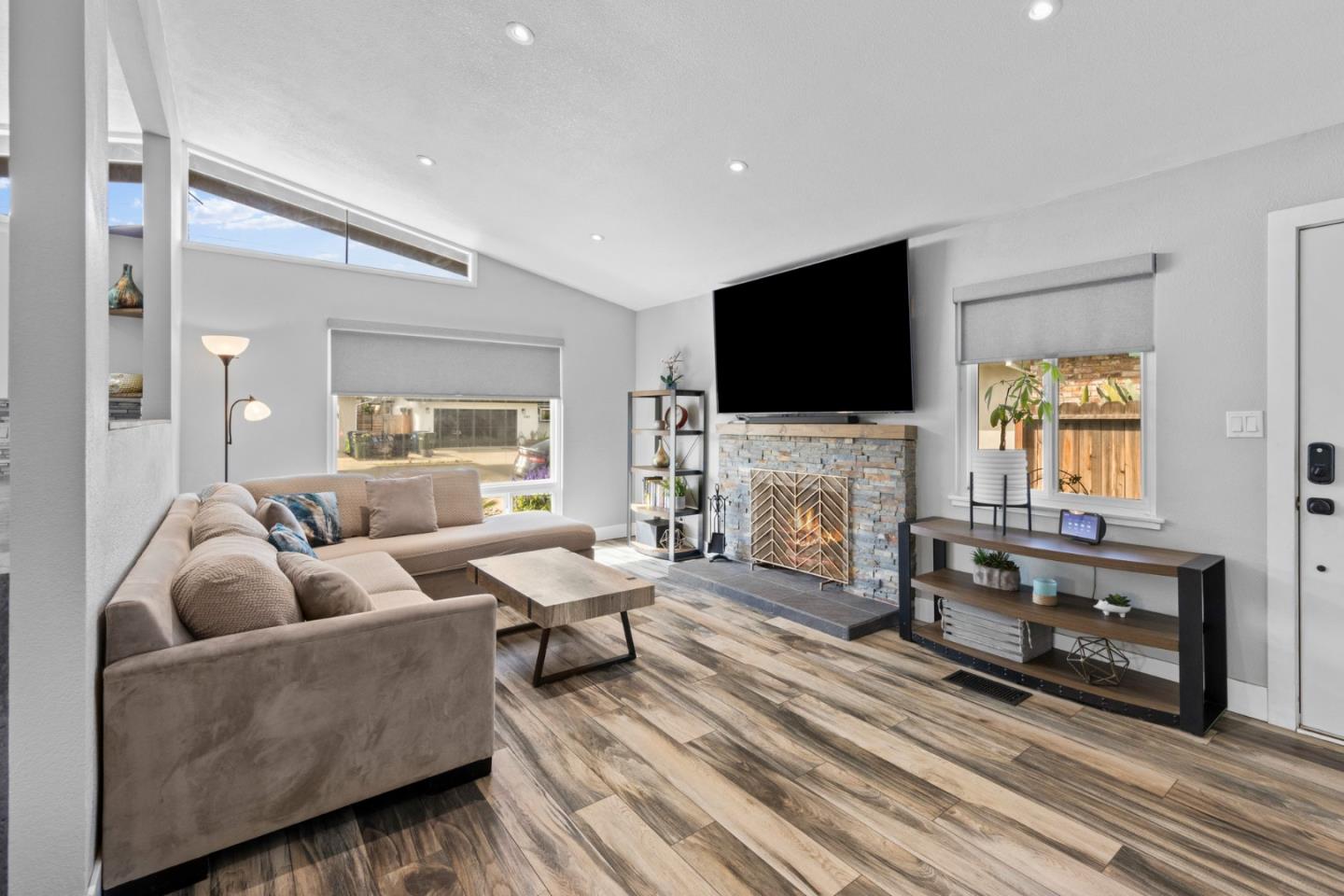 1430 Spruce Street Livermore, CA 94551 - Photo 6 of 32 a living room with furniture a fireplace and a flat screen tv