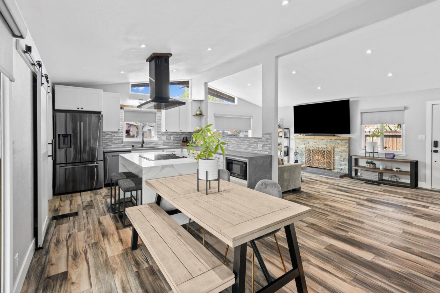 1430 Spruce Street Livermore, CA 94551 - Photo 10 of 32 a kitchen with a table chairs refrigerator and microwave