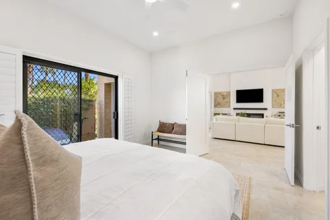 a bedroom with a large bed and tv