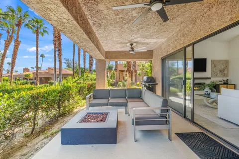 a view of balcony with chair and table