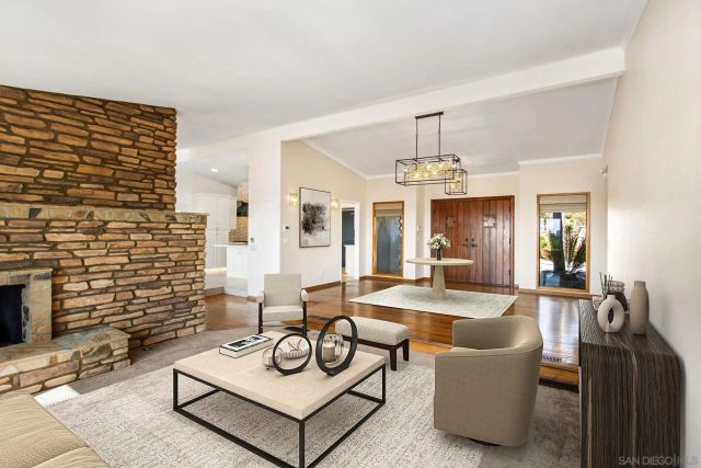 a view of a livingroom with furniture and a fireplace
