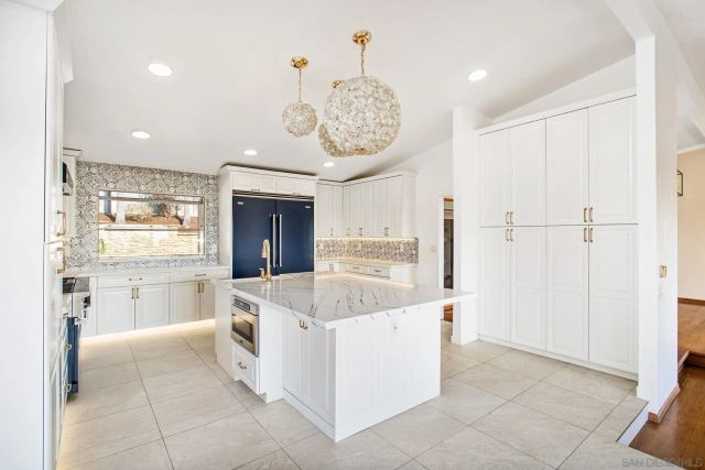 a kitchen with a sink stove and refrigerator