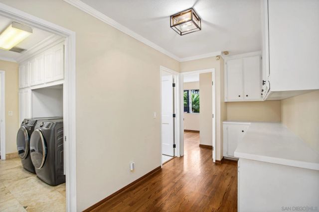 a bedroom with a large bed and a flat screen tv