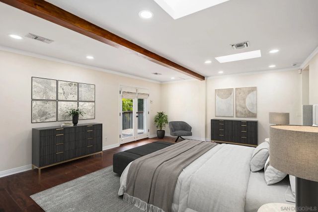 a bathroom with a sink a toilet a mirror and shower