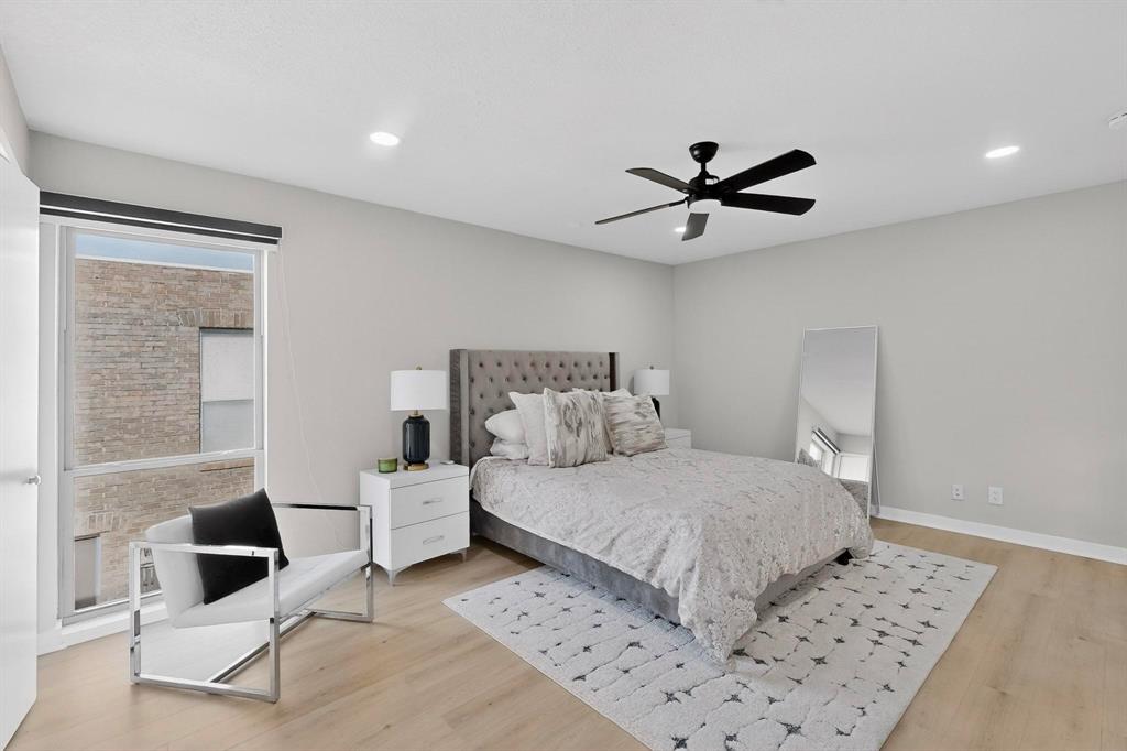 5015 Thunder Road Dallas, TX 75244 - Photo 20 of 31 a bedroom with a bed and a table in it