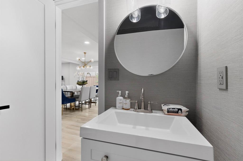 5015 Thunder Road Dallas, TX 75244 - Photo 22 of 31 a bathroom with a sink mirror and vanity