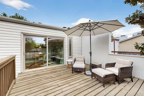a patio with patio outdoor seating and barbeque oven