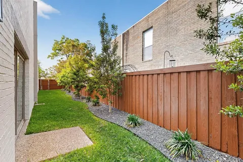 a view of a backyard with plants
