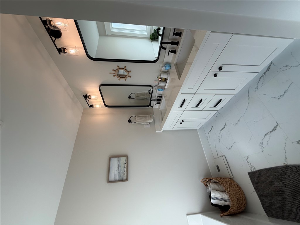 119 Dobbins Road Townville, SC 29689 - Photo 15 of 25 This spacious bathroom features a double vanity and sleek modern finishes, creating a refreshing atmosphere.