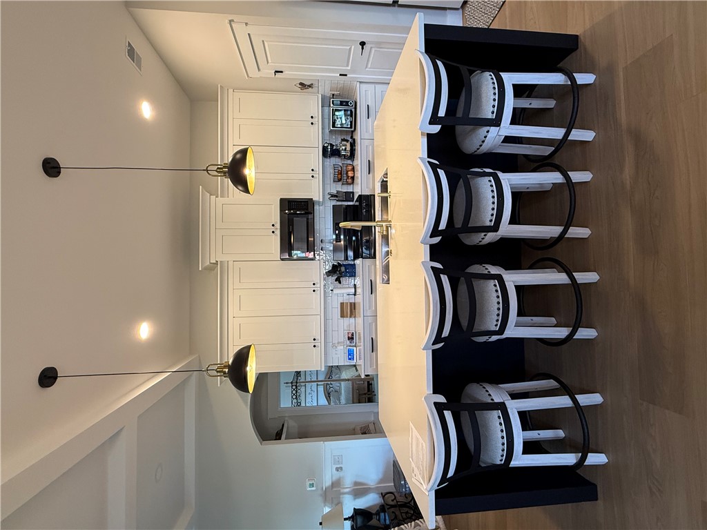 119 Dobbins Road Townville, SC 29689 - Photo 18 of 25 This kitchen features a bright ambiance with recessed lighting and a large island, perfect for gathering.
