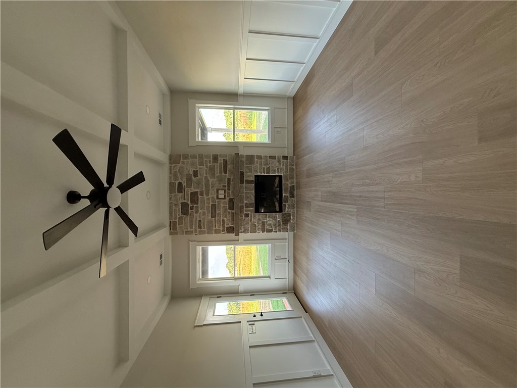 119 Dobbins Road Townville, SC 29689 - Photo 24 of 25 This bright living space features elegant flooring and a cozy fireplace, perfect for gatherings.