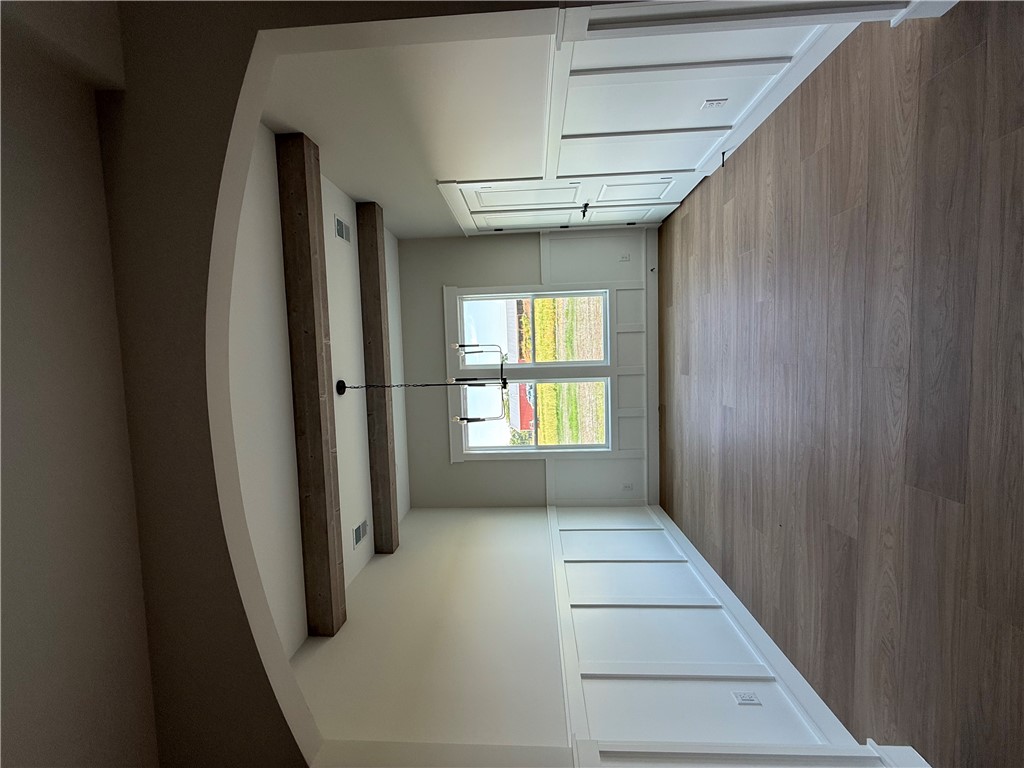 119 Dobbins Road Townville, SC 29689 - Photo 25 of 25 This bright space features a striking beamed ceiling and elegant wall paneling, creating an inviting atmosphere.