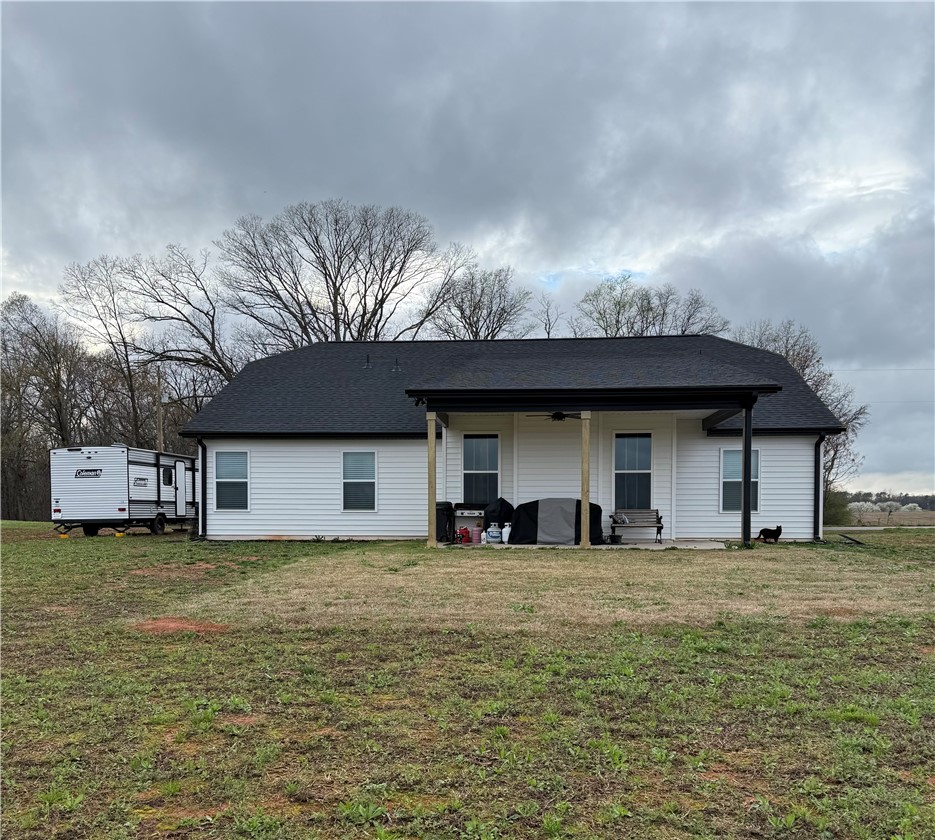 119 Dobbins Road Townville, SC 29689 - Photo 8 of 25 This residence offers a tranquil outdoor retreat with a spacious yard and covered patio.