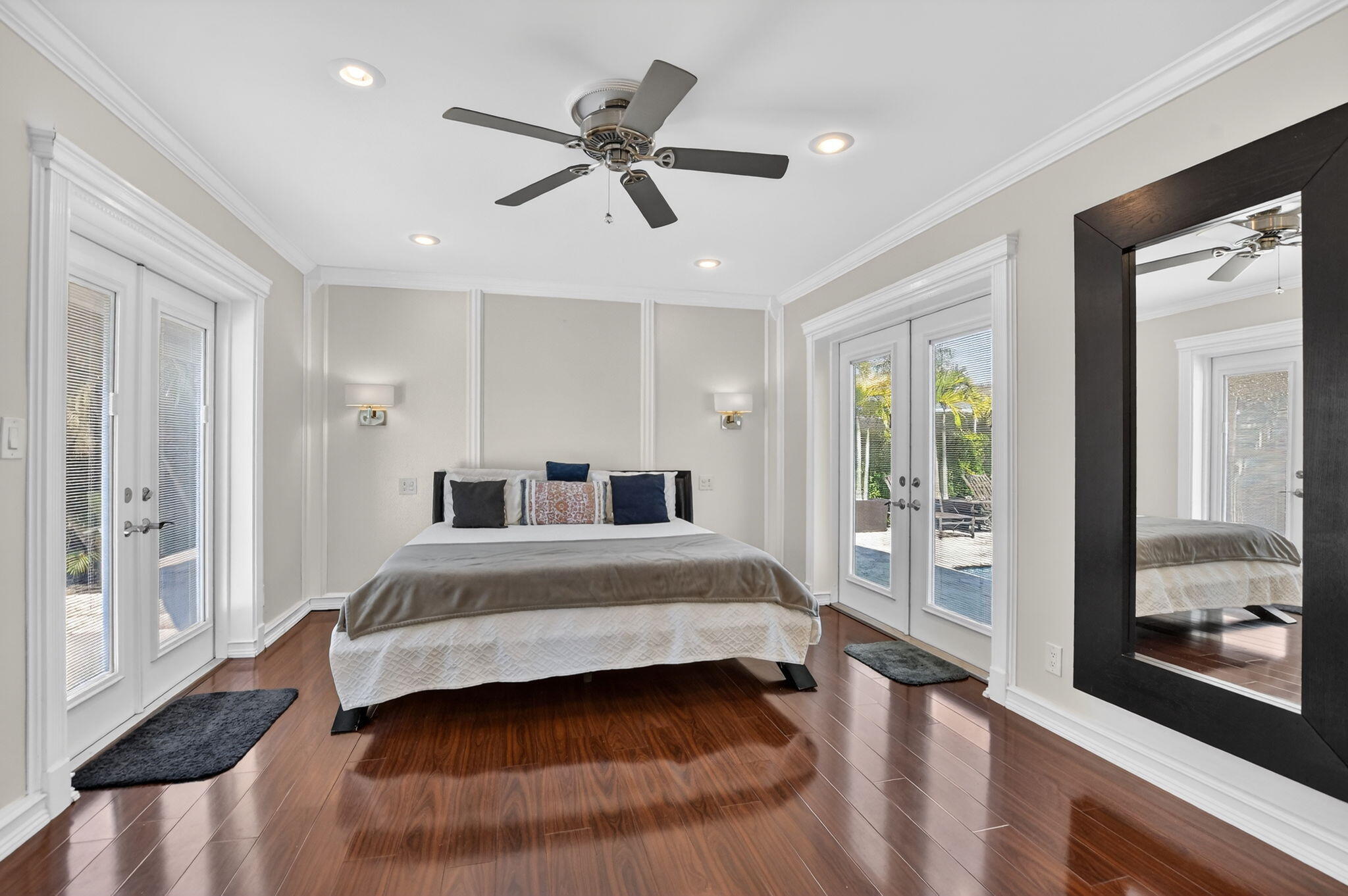 1455 Isabel Road East Boca Raton, FL 33486 - Photo 17 of 33 a spacious bedroom with a bed and a large window