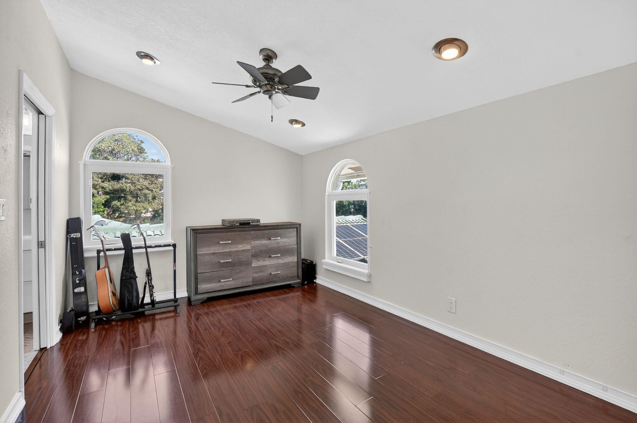 1455 Isabel Road East Boca Raton, FL 33486 - Photo 21 of 33 wooden floor in an empty room with a window