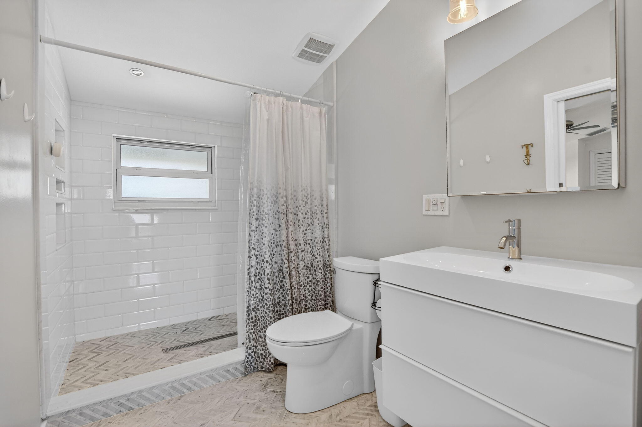1455 Isabel Road East Boca Raton, FL 33486 - Photo 22 of 33 a bathroom with a toilet sink and shower