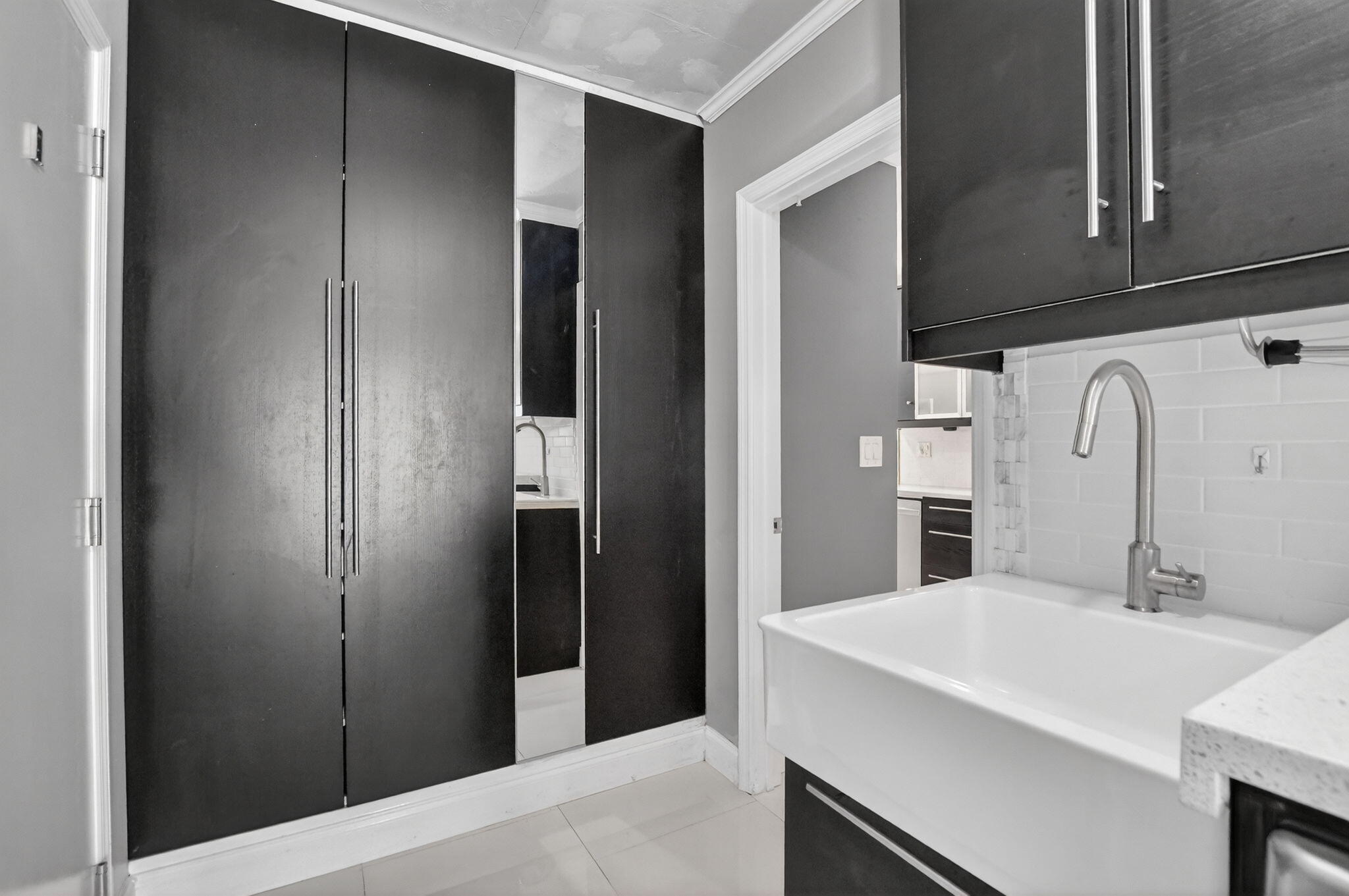 1455 Isabel Road East Boca Raton, FL 33486 - Photo 28 of 33 a bathroom with a sink and a mirror