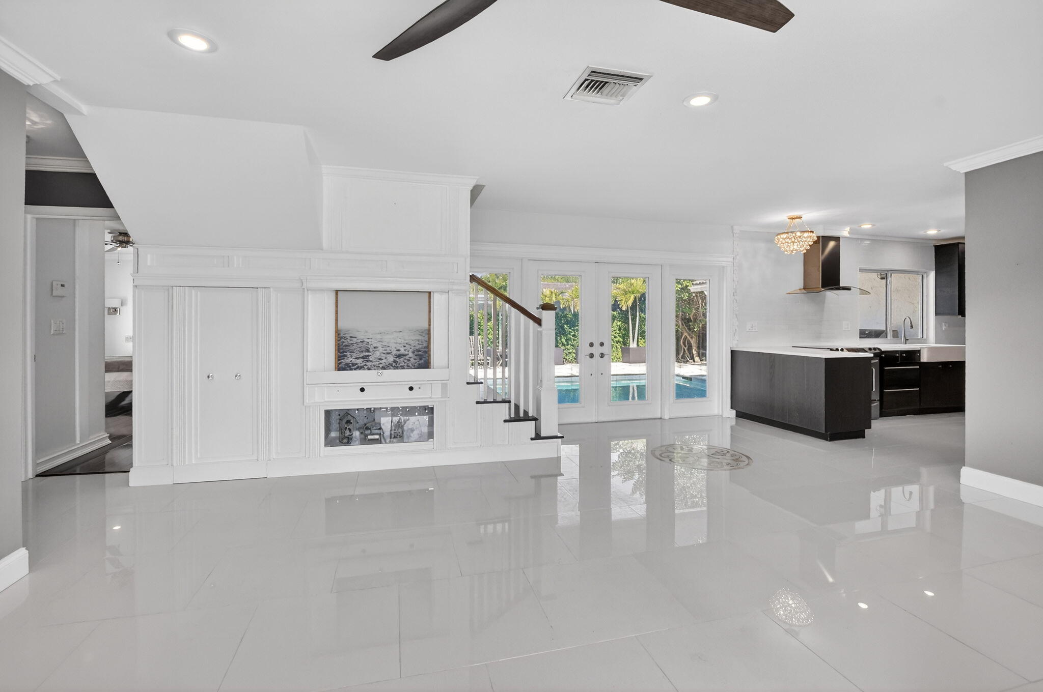 1455 Isabel Road East Boca Raton, FL 33486 - Photo 5 of 33 a large white kitchen with a large window