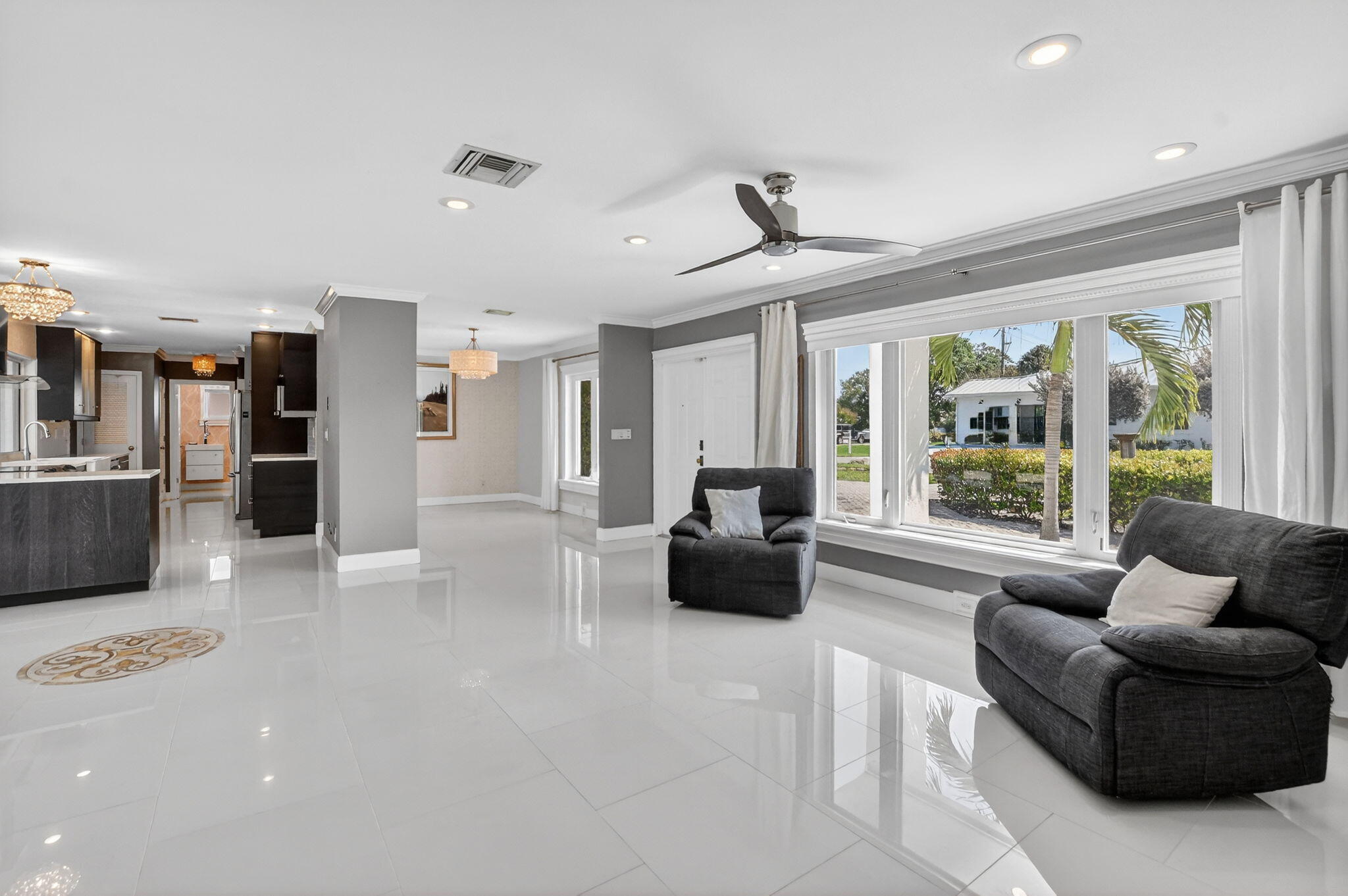1455 Isabel Road East Boca Raton, FL 33486 - Photo 6 of 33 a living room with furniture and a large window