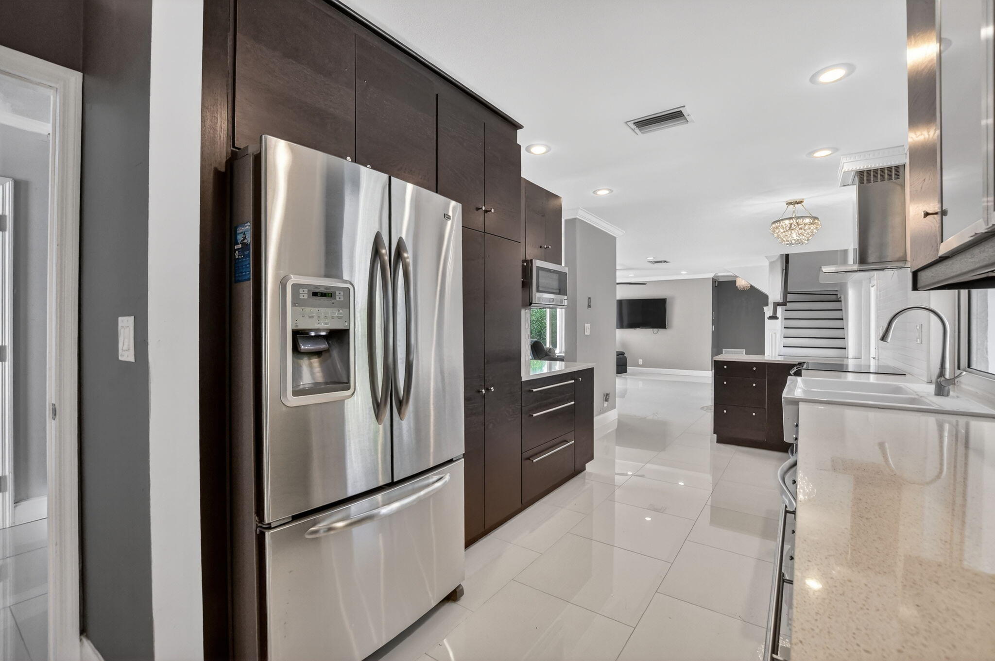 1455 Isabel Road East Boca Raton, FL 33486 - Photo 9 of 33 a kitchen with stainless steel appliances granite countertop a refrigerator and a sink