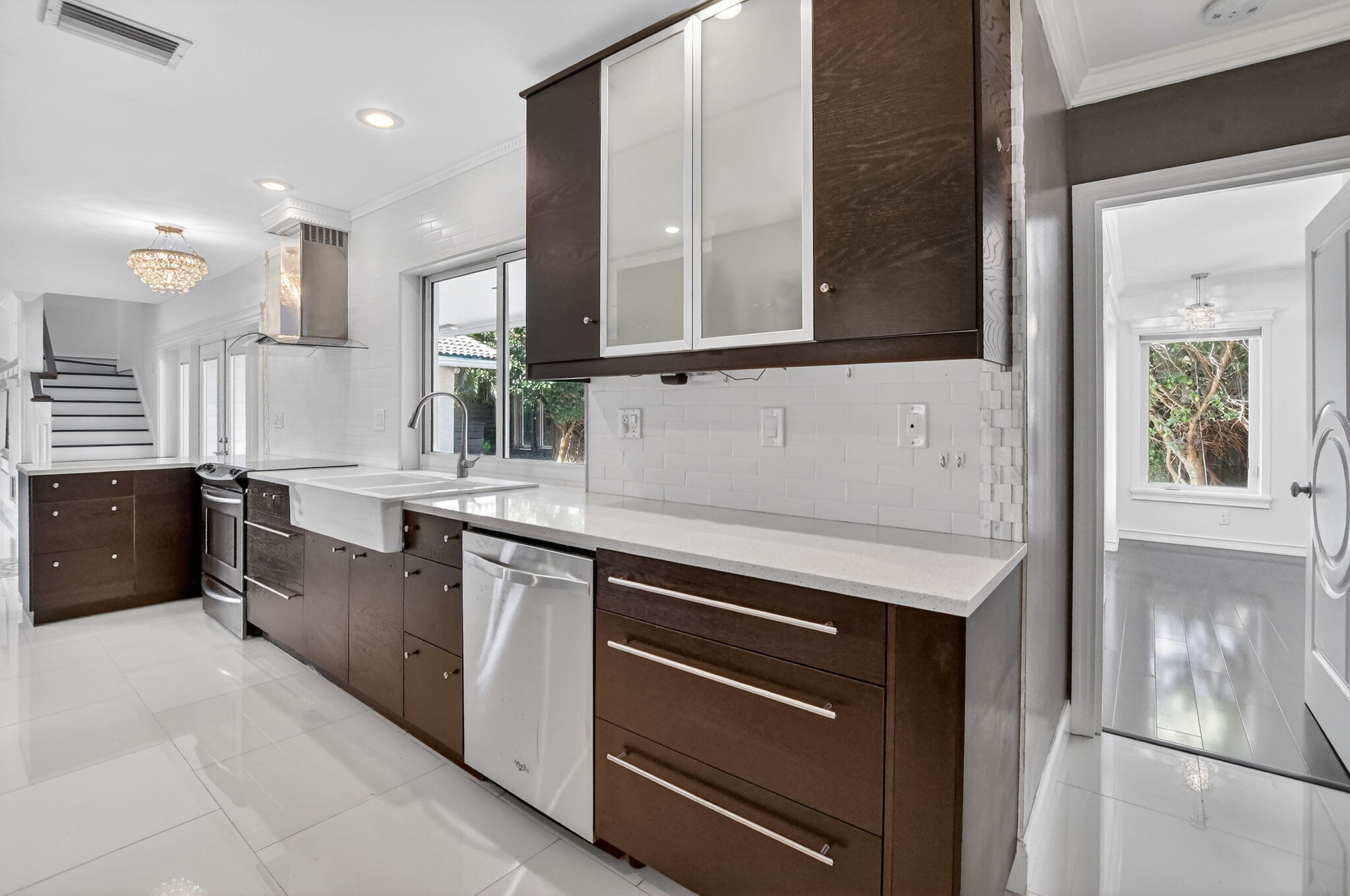 1455 Isabel Road East Boca Raton, FL 33486 - Photo 10 of 33 a kitchen with stainless steel appliances granite countertop a sink and a stove