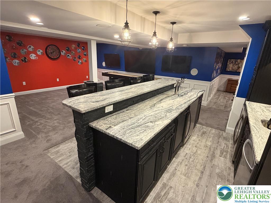 4157 Walter Road Bethlehem, PA 18020 - Photo 33 of 36 Granite counters and recessed lighting outfit this spacious entertainment area, perfect for gatherings.