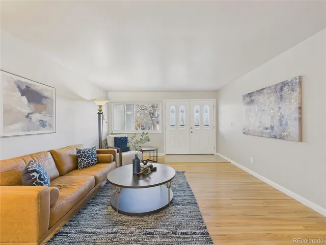 a living room with furniture and a rug
