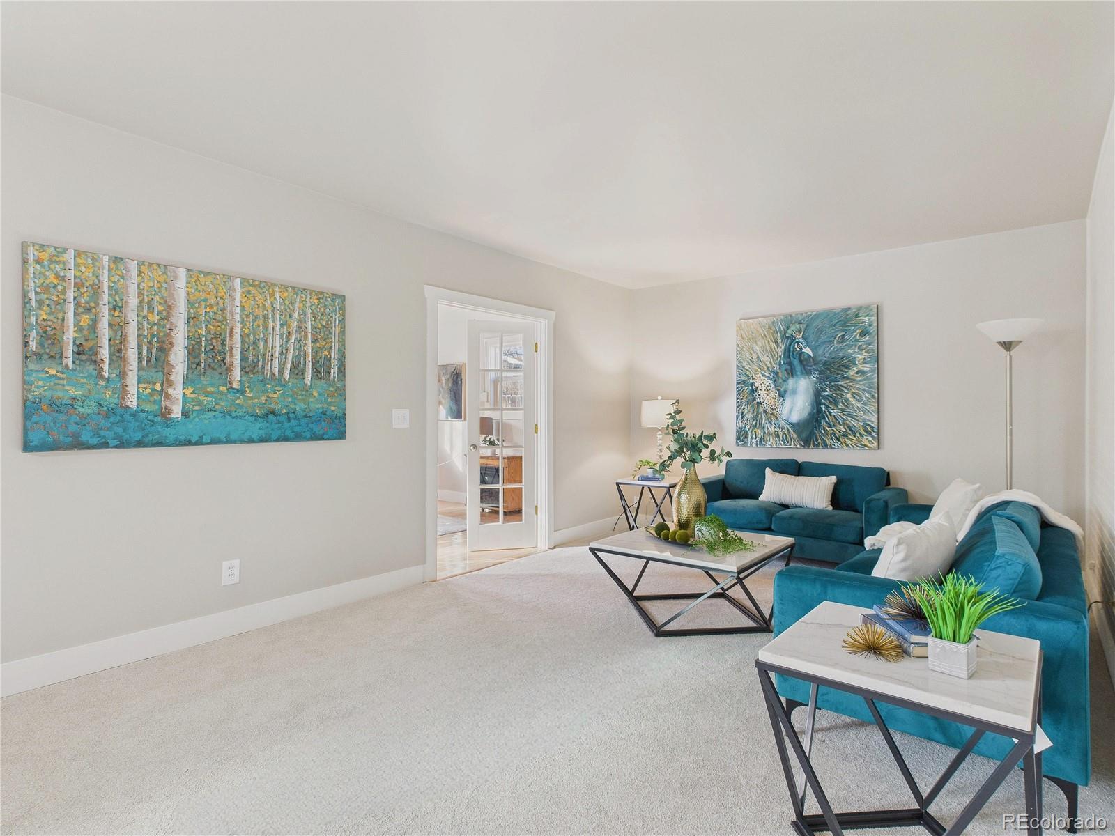 6085 Simms Street Arvada, CO 80004 - Photo 20 of 32 a living room with furniture and a window