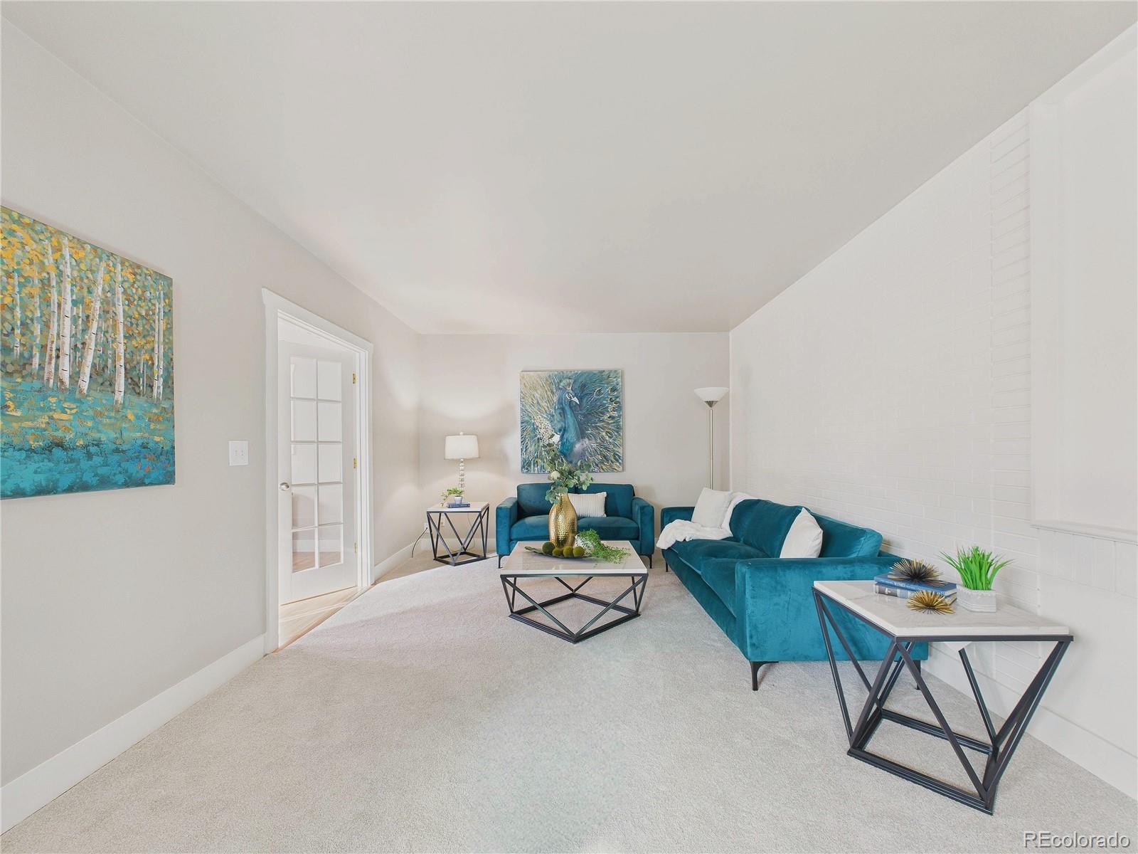 6085 Simms Street Arvada, CO 80004 - Photo 21 of 32 a living room with furniture and a window
