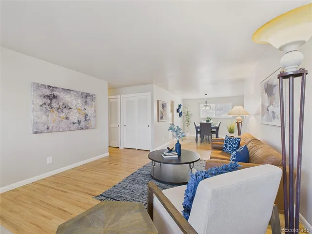 a living room with furniture and a table