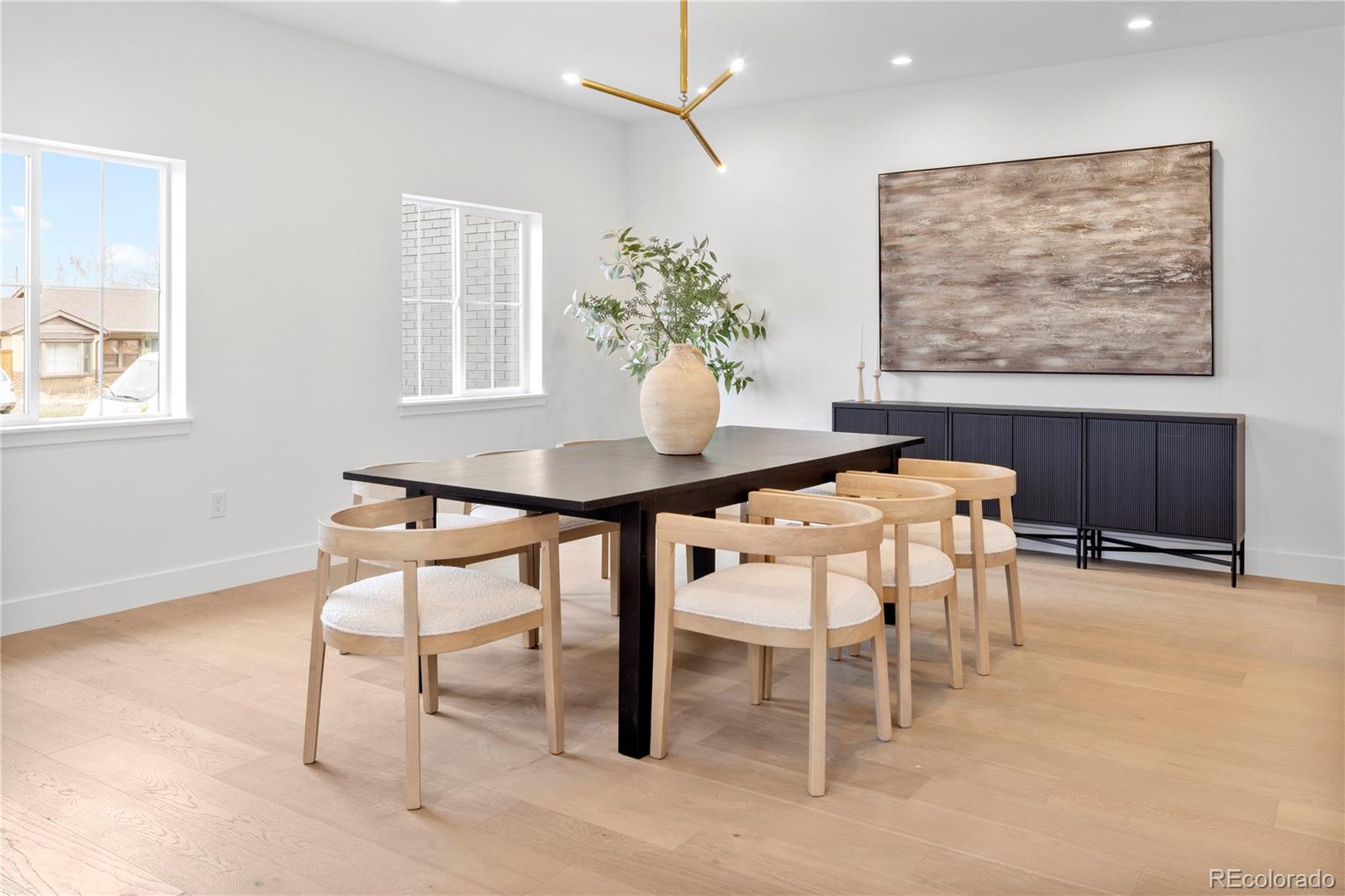 3283 Ames Street Wheat Ridge, CO 80212 - Photo 6 of 41 a dining room with furniture and a potted plant