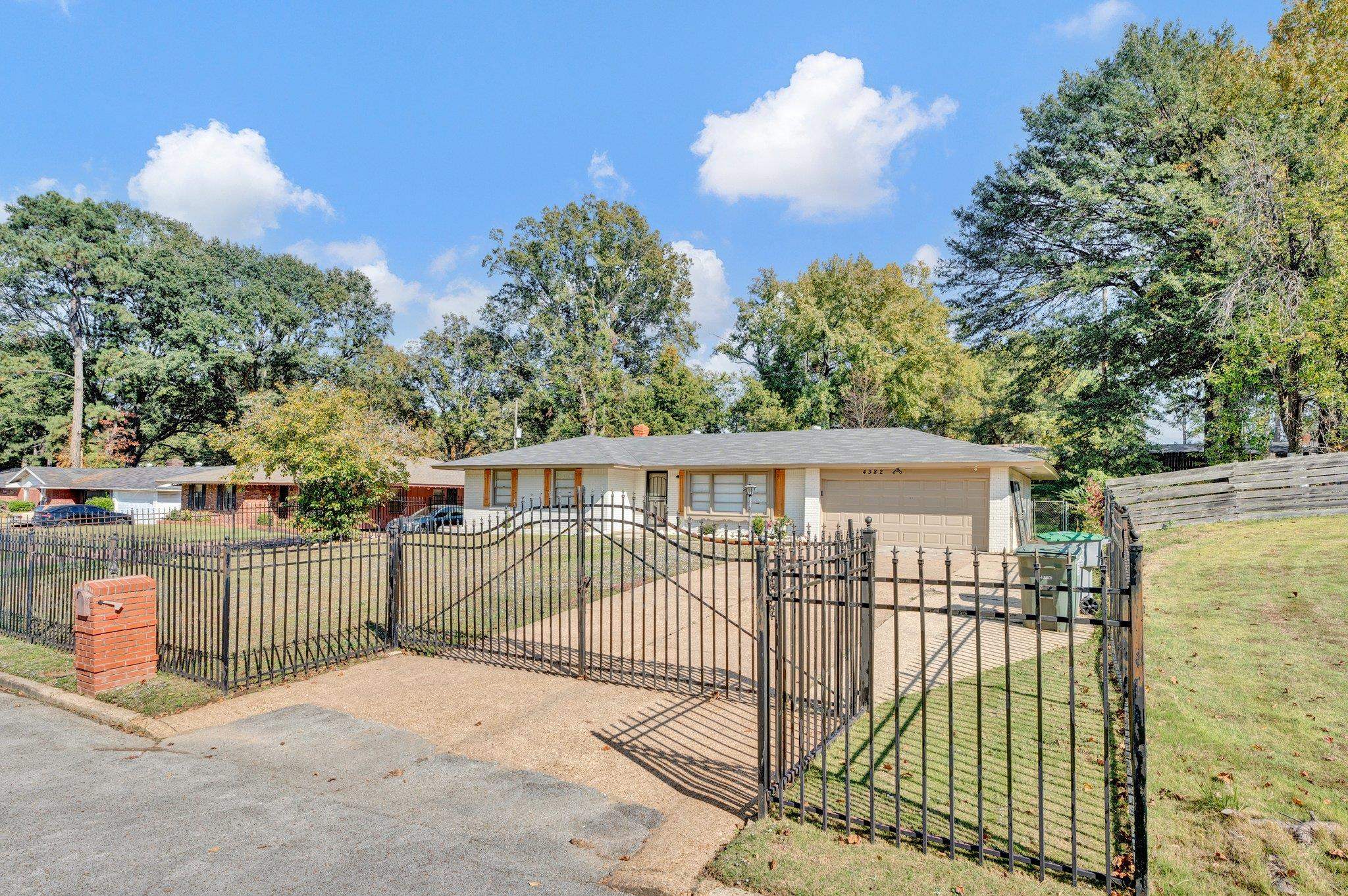 4382 Ruth Drive Memphis, TN 38109 - Photo 2 of 32 View of front of house with a front lawn and a garage