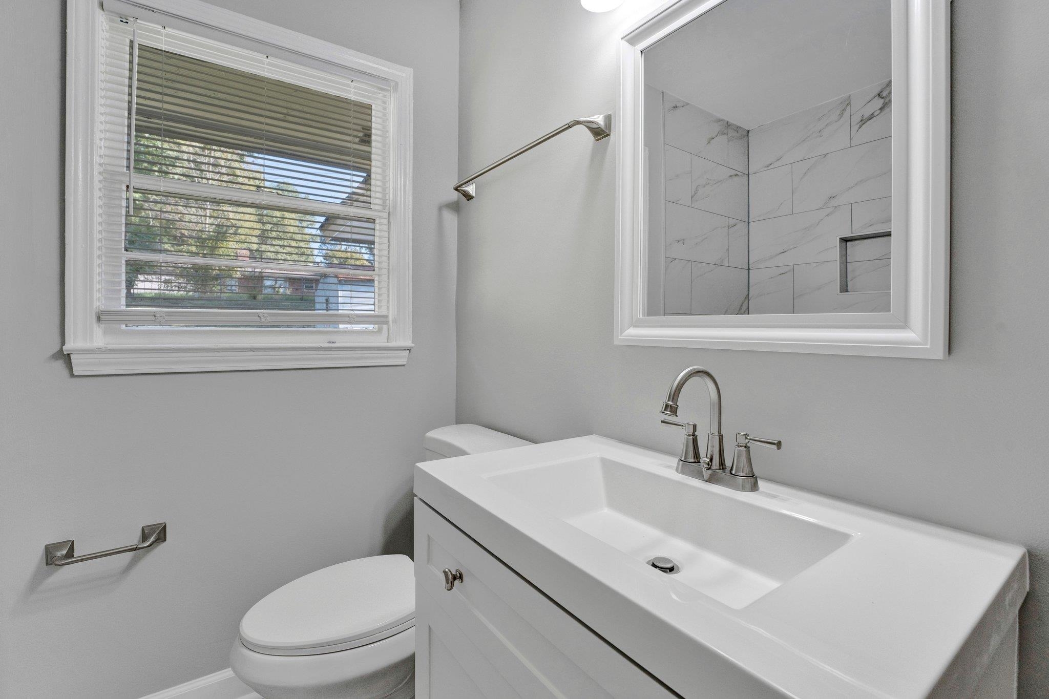4382 Ruth Drive Memphis, TN 38109 - Photo 21 of 32 Bathroom with vanity and toilet